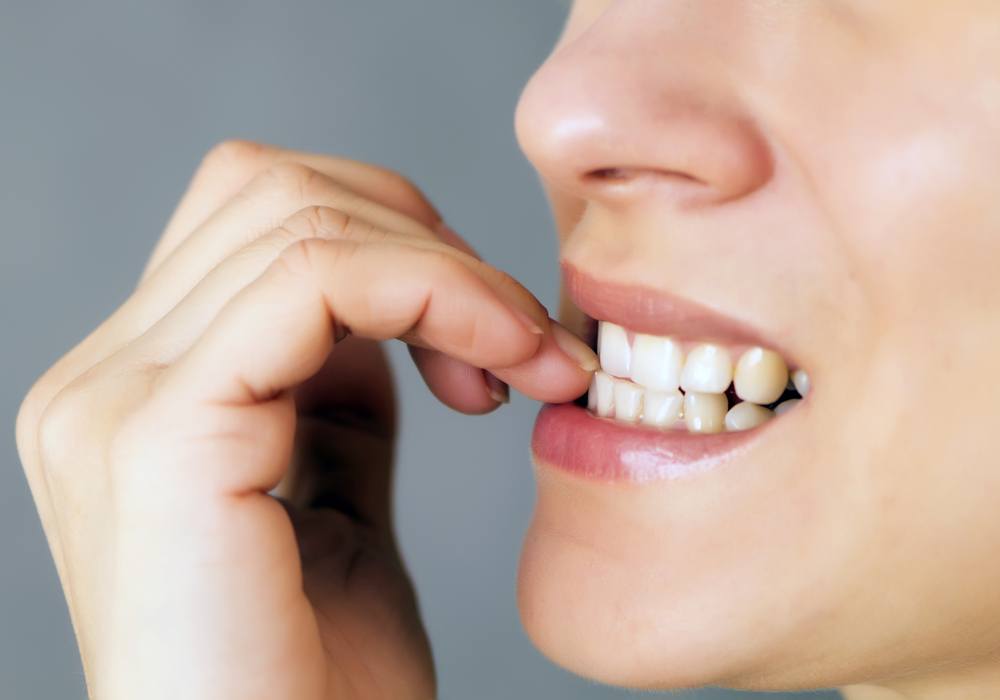 Close-up shot of bad behavior or habit of biting toes. Refer as stress,  anxiety, worry and health issue. All kids toes are bitten and pinky nail is  bl Stock Photo - Alamy