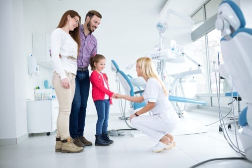 Family visits dentist in dental office for first time together-img-blog