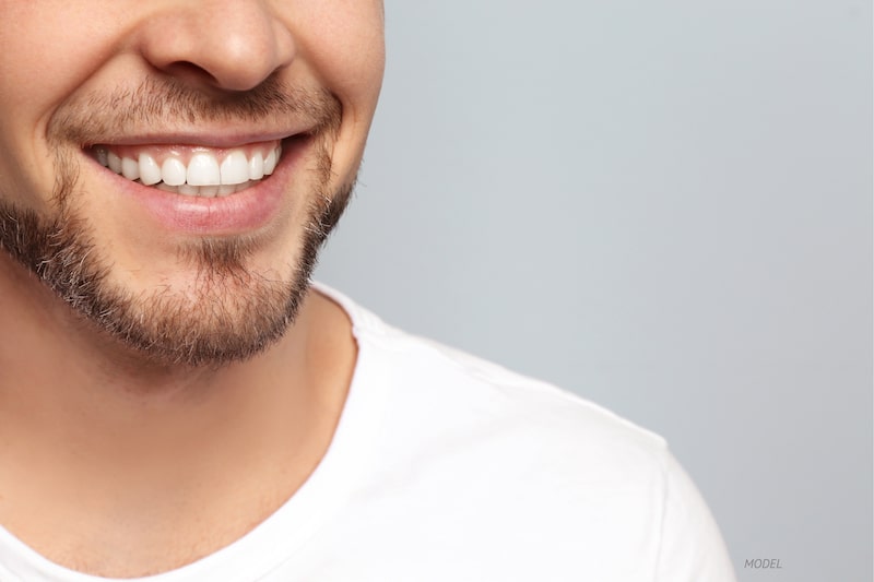  Close-up of man's smile with white teeth